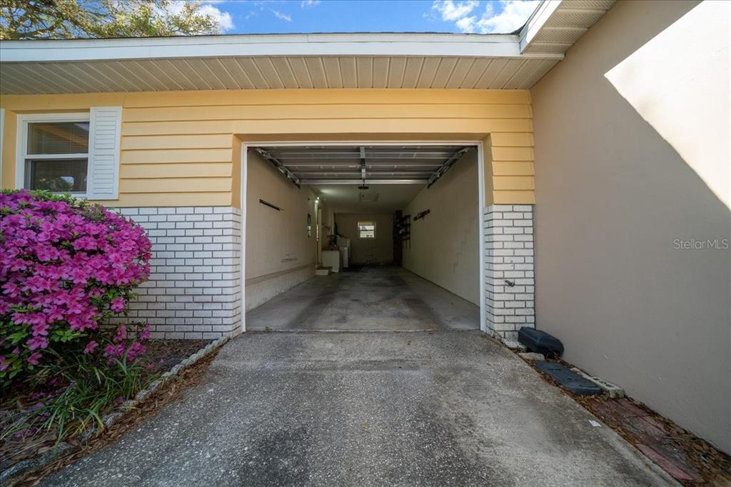 8702 Southwest 94 Street, Unit A Ocala, FL 34481 - Photo 40 of 55 a view of a house with a garage