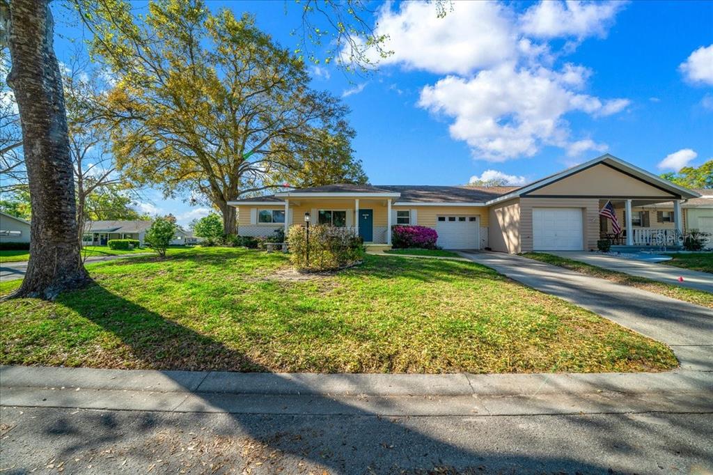 8702 Southwest 94 Street, Unit A Ocala, FL 34481 - Photo 46 of 55 front view of a house with a yard