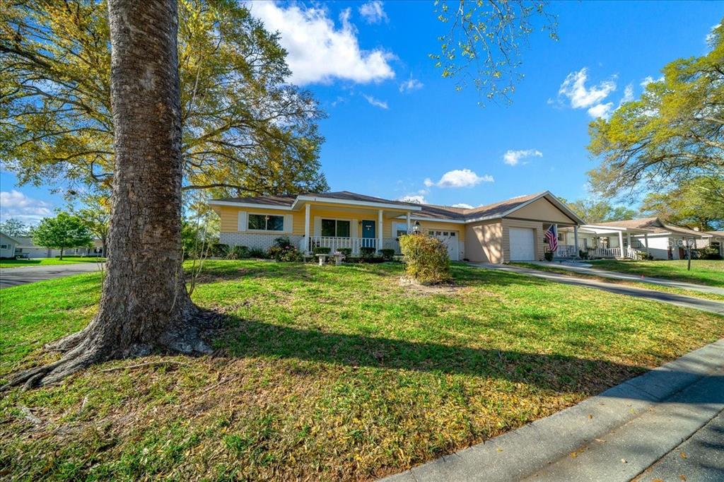 8702 Southwest 94 Street, Unit A Ocala, FL 34481 - Photo 47 of 55 a front view of a house with a yard