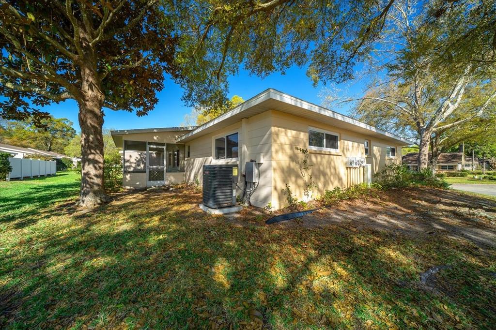 8702 Southwest 94 Street, Unit A Ocala, FL 34481 - Photo 50 of 55 a front view of a house with a garden