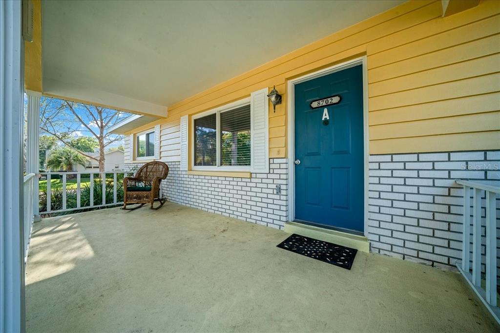 8702 Southwest 94 Street, Unit A Ocala, FL 34481 - Photo 5 of 55 a backyard of a house with table and chairs