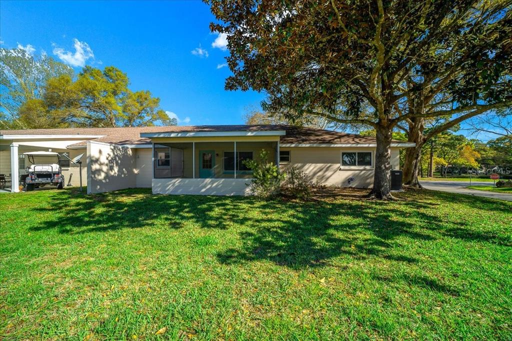 8702 Southwest 94 Street, Unit A Ocala, FL 34481 - Photo 51 of 55 a view of house with a yard