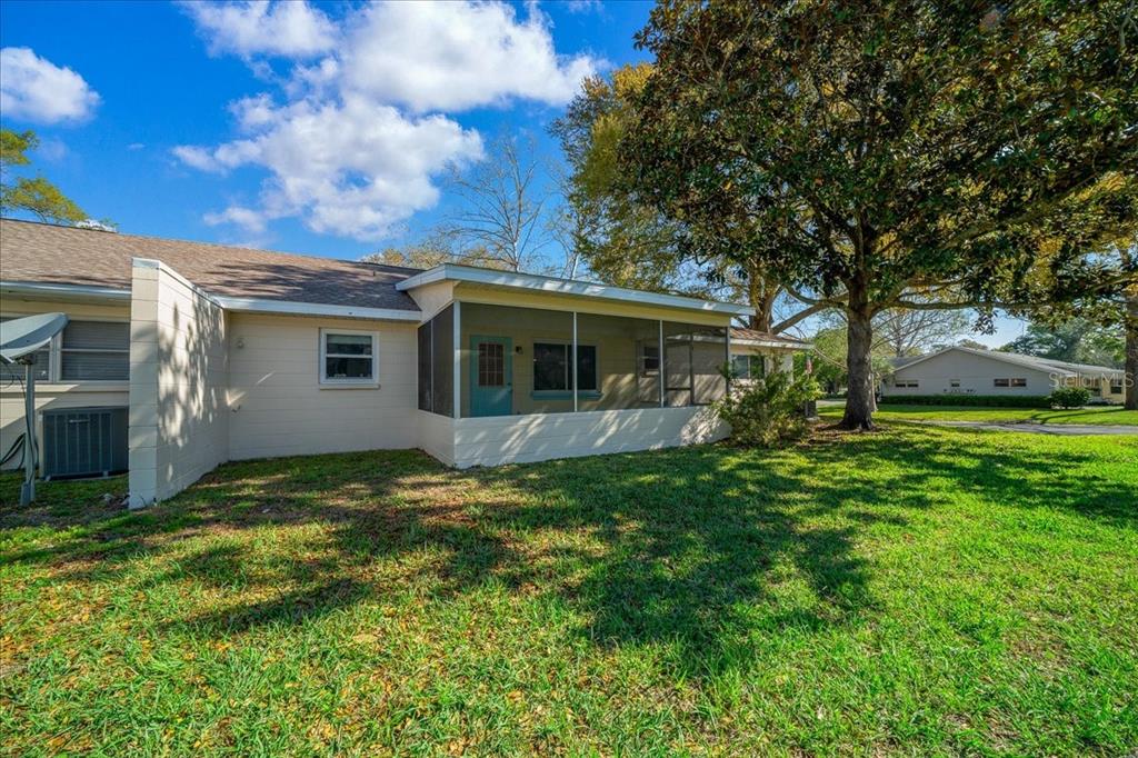 8702 Southwest 94 Street, Unit A Ocala, FL 34481 - Photo 52 of 55 a view of a house with backyard and garden