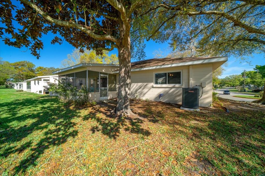 8702 Southwest 94 Street, Unit A Ocala, FL 34481 - Photo 53 of 55 a front view of a house with a yard and potted plants