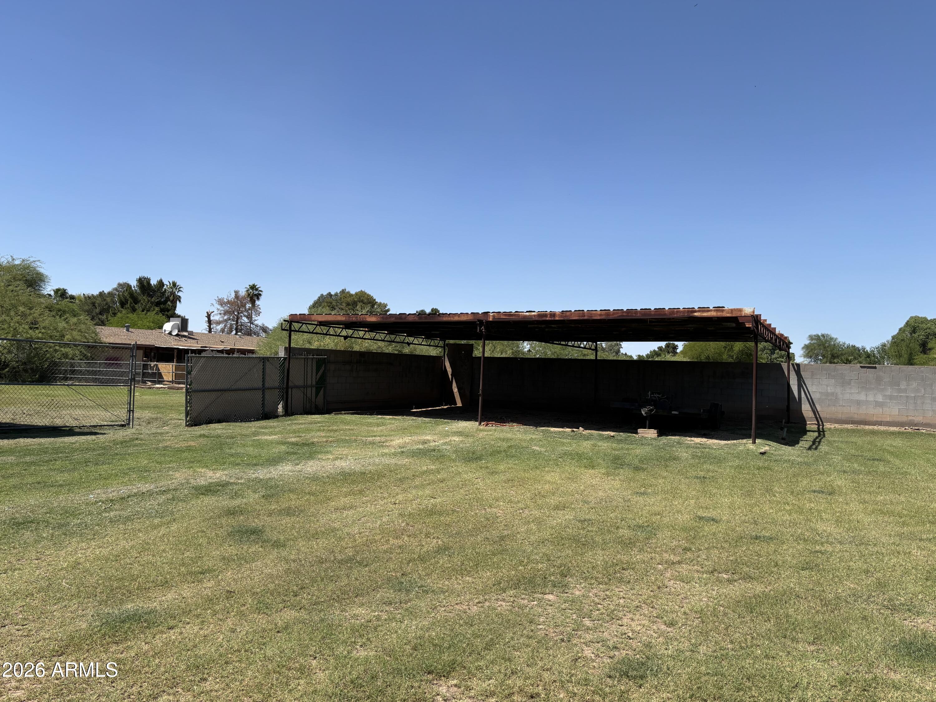 6508 West Fremont Road Laveen, AZ 85339 - Photo 22 of 32 a backyard of a house