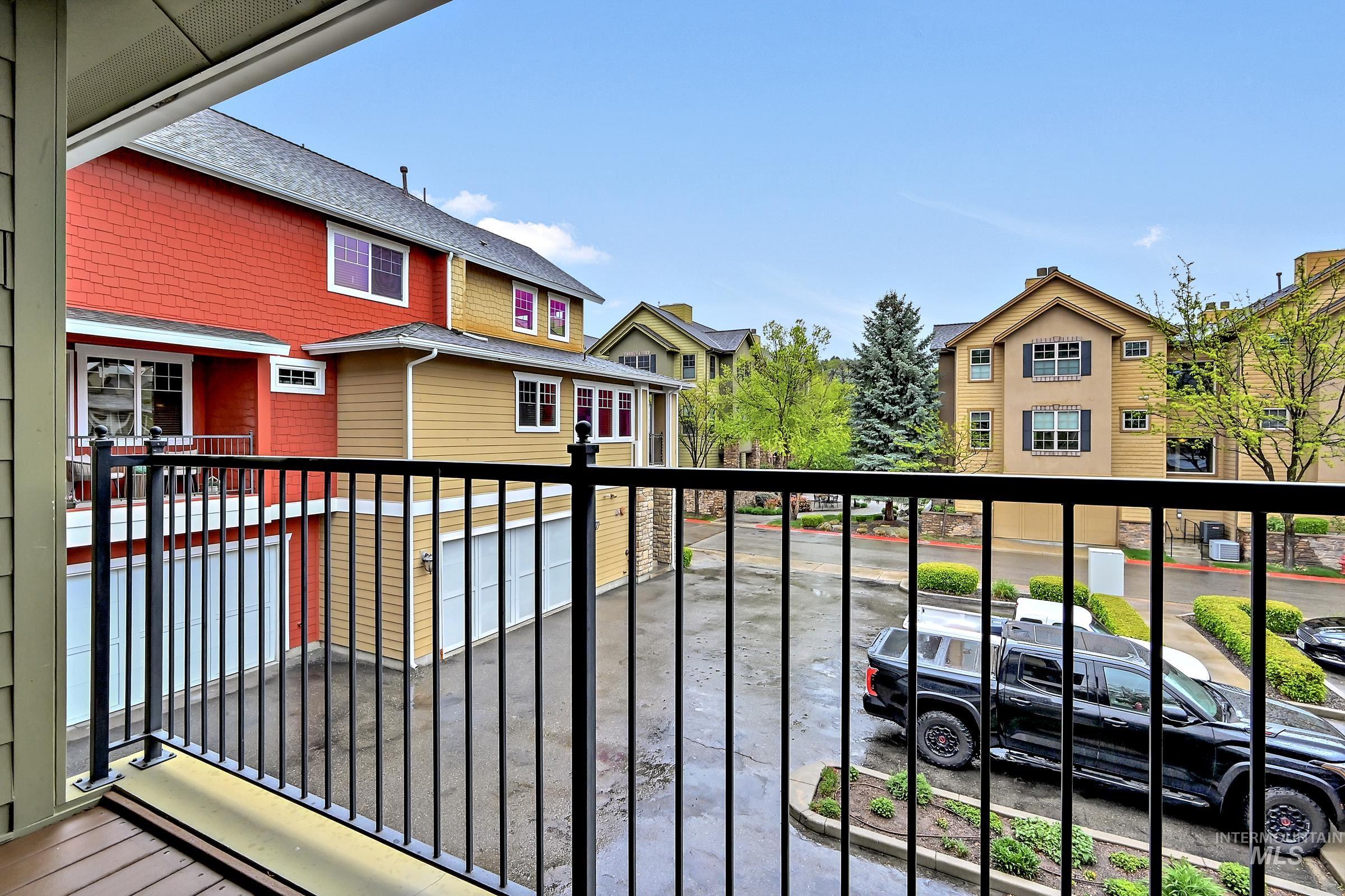 2476 North Bogus Basin Road Boise, ID 83702 - Photo 14 of 48 Covered deck with railing and neighborhood views. Comfortable outdoor space for relaxing.