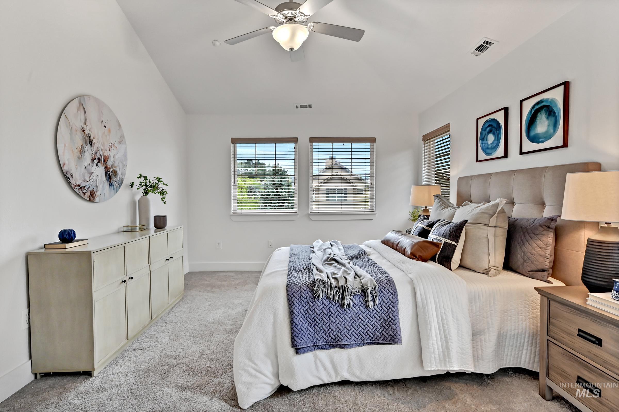 2476 North Bogus Basin Road Boise, ID 83702 - Photo 18 of 48 Primary ensuite bedroom with carpet, ceiling fan, and neutral tones. Bright and comfortable space.