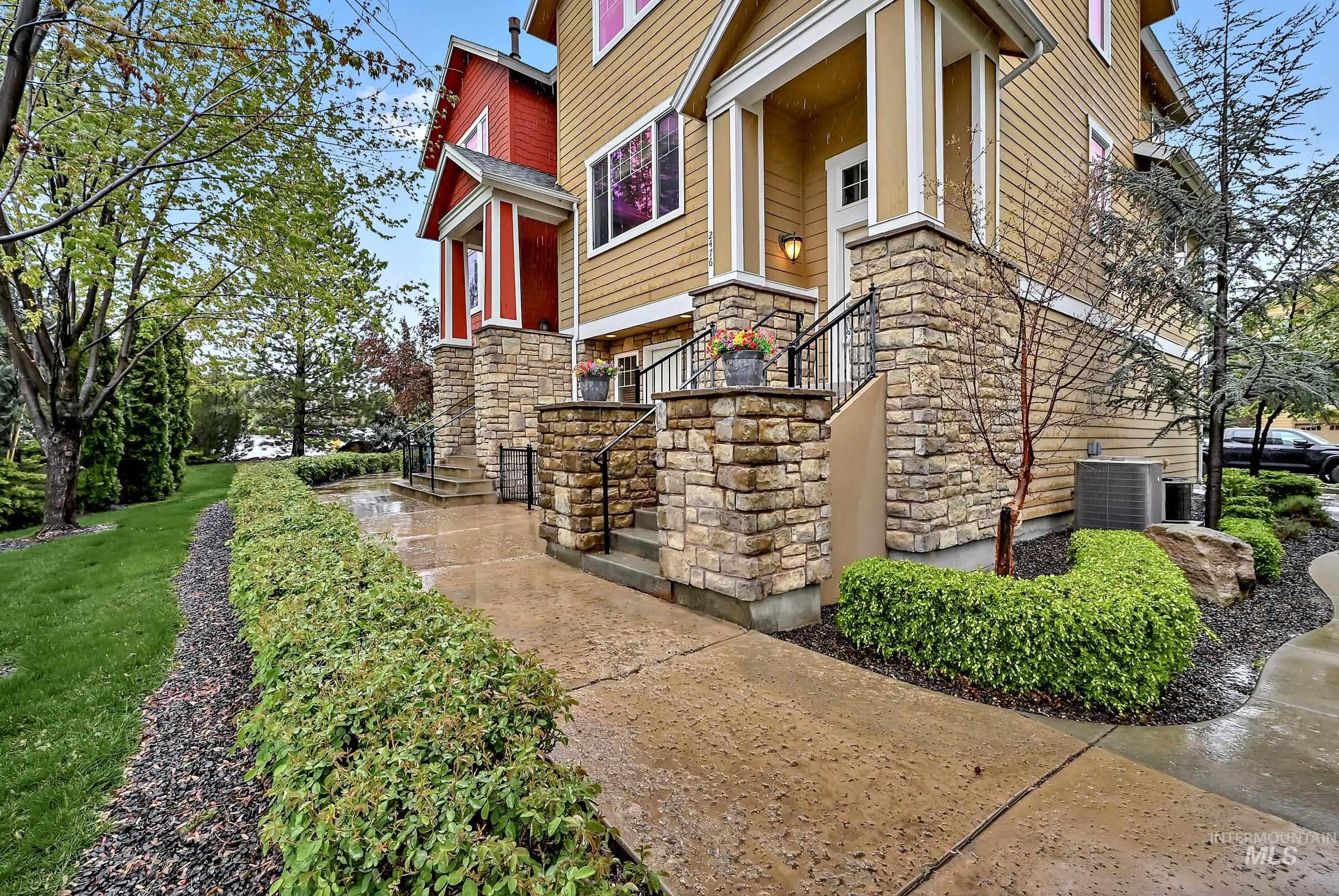 2476 North Bogus Basin Road Boise, ID 83702 - Photo 2 of 48 Angled exterior view showing brick, siding, and tidy front walkway. Clean, well-maintained appearance.