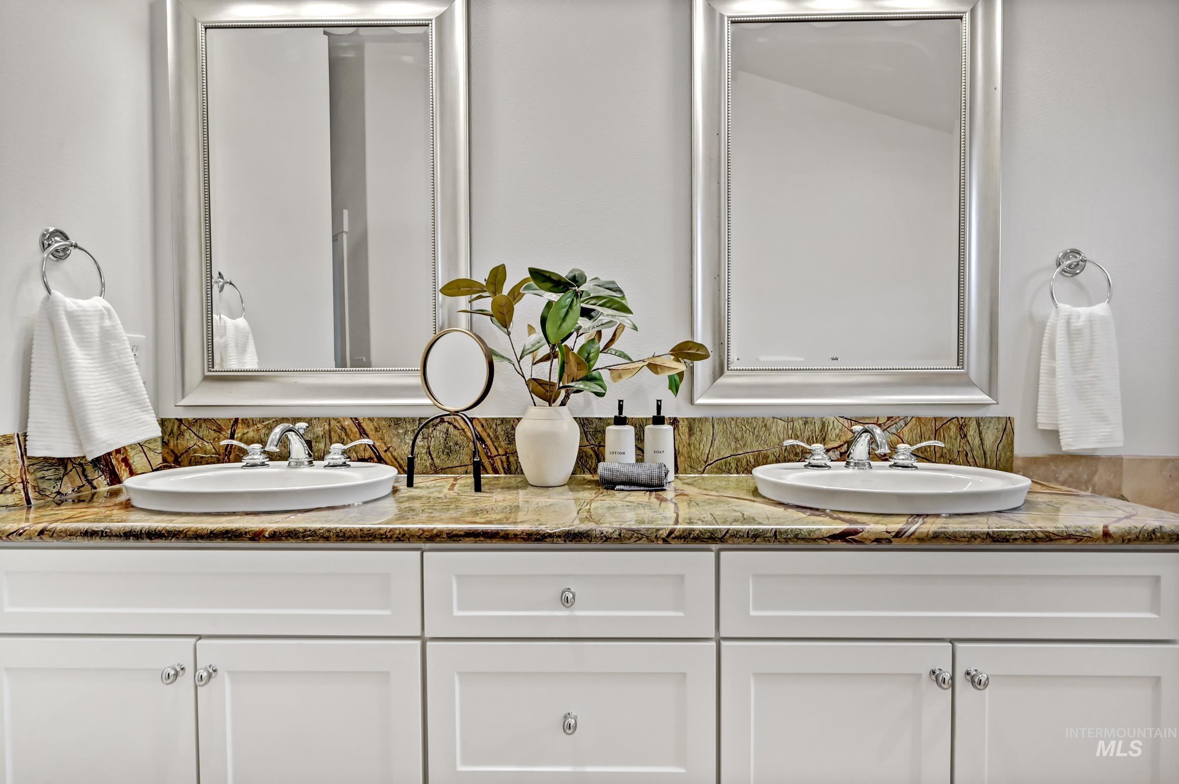 2476 North Bogus Basin Road Boise, ID 83702 - Photo 21 of 48 Ensuite bathroom with dual vanity and ample counter space. Bright and well-maintained with clean finishes.