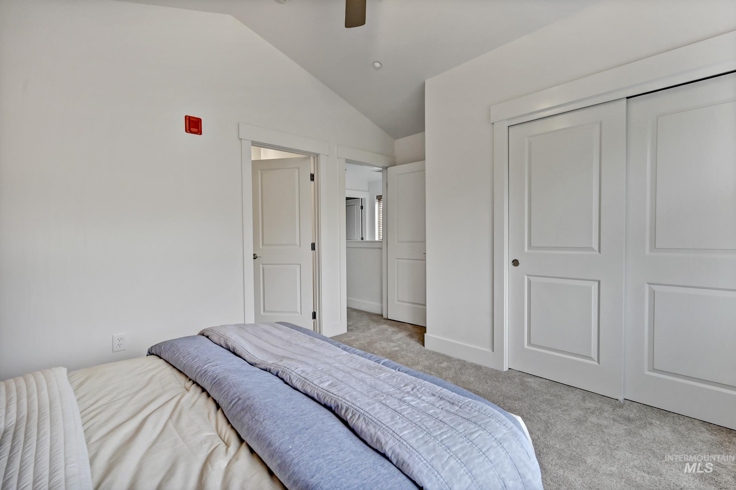 2476 North Bogus Basin Road Boise, ID 83702 - Photo 25 of 48 Ensuite bedroom with carpet and natural light. Clean, simple layout for flexible use.