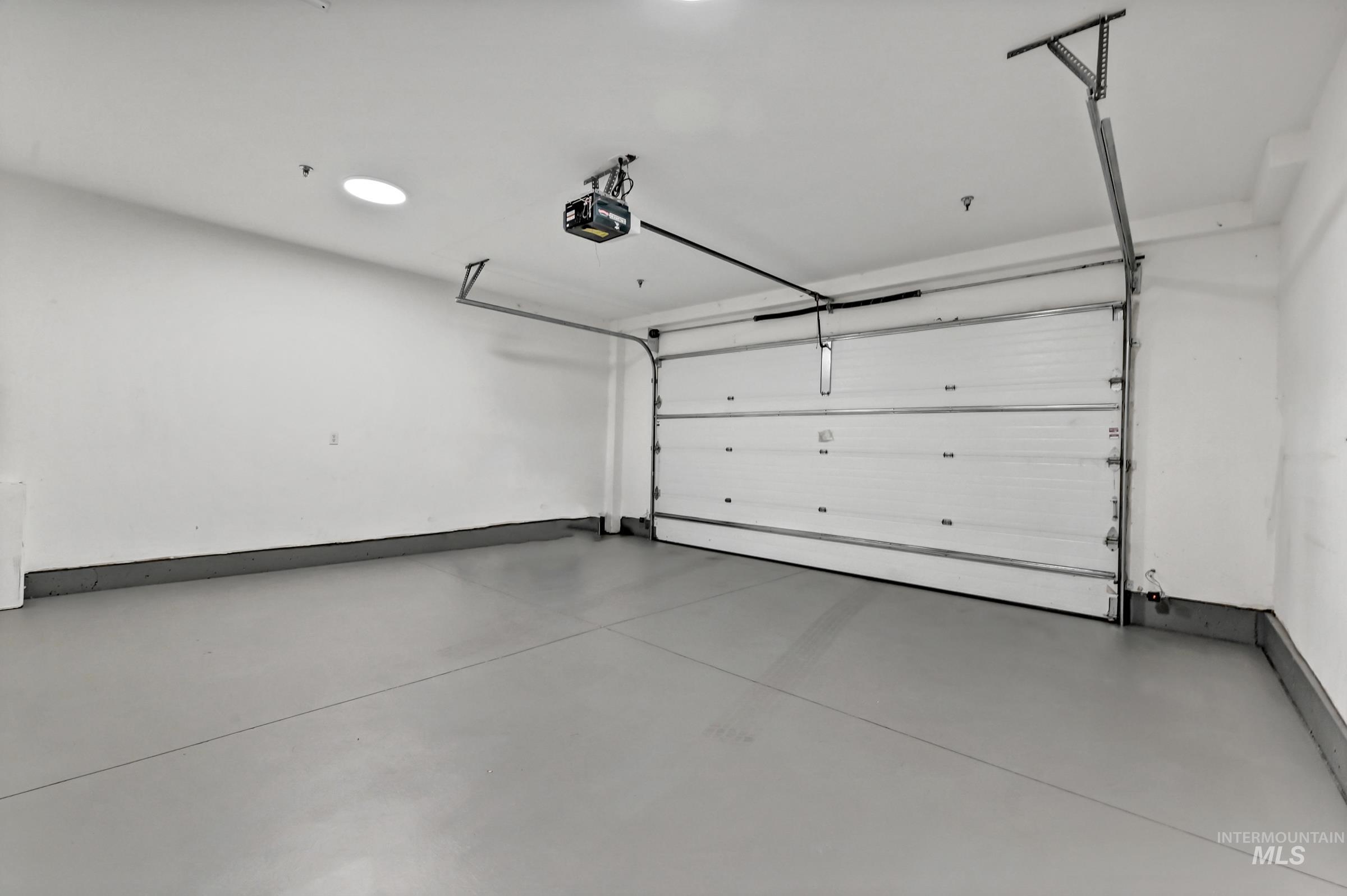 2476 North Bogus Basin Road Boise, ID 83702 - Photo 32 of 48 Two-car garage with open floor space and storage potential. Clean and well-maintained.