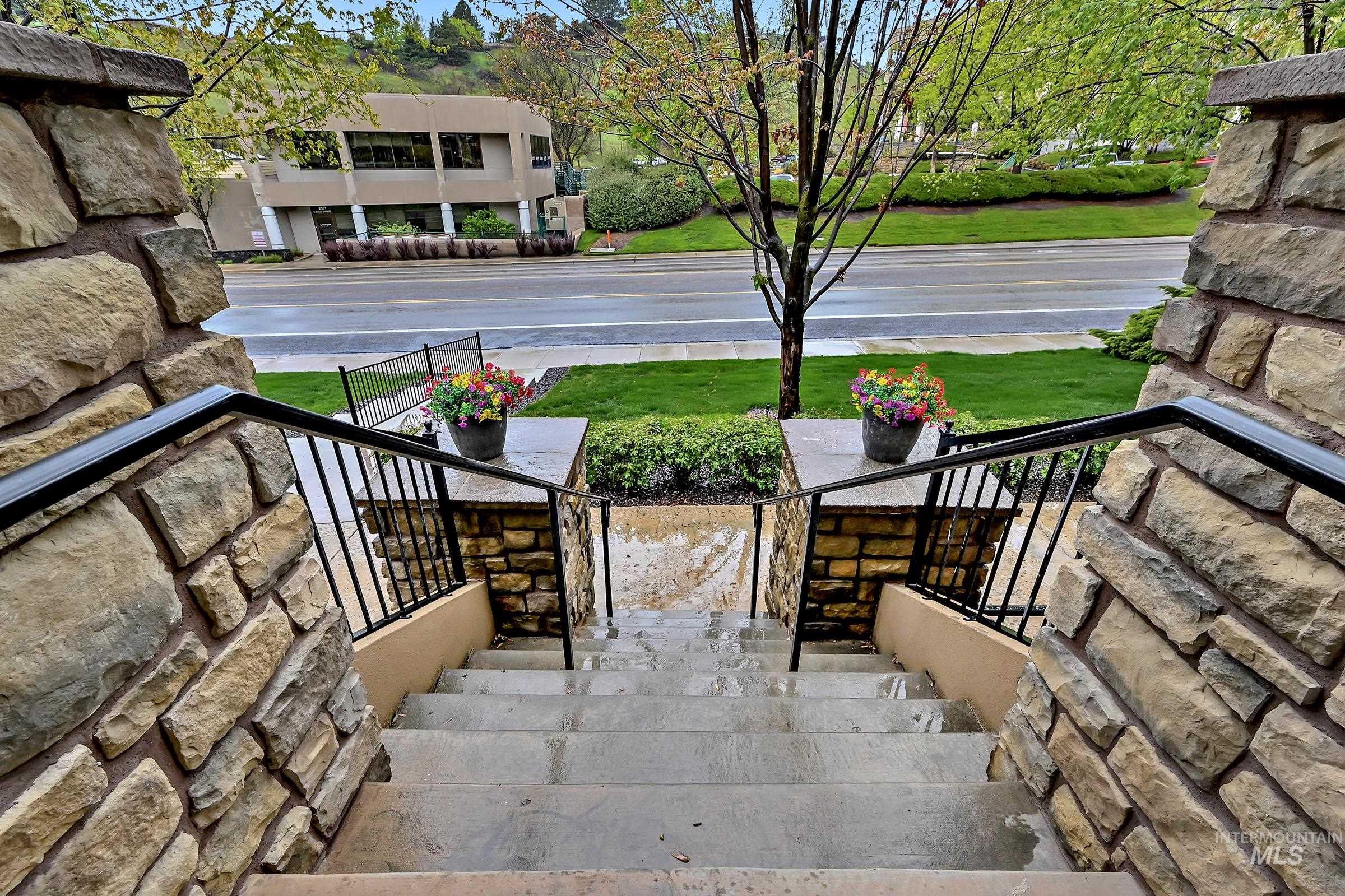 2476 North Bogus Basin Road Boise, ID 83702 - Photo 34 of 48 Main entry stairs leading to front door with railing and landscaped surroundings. Clean and welcoming access.