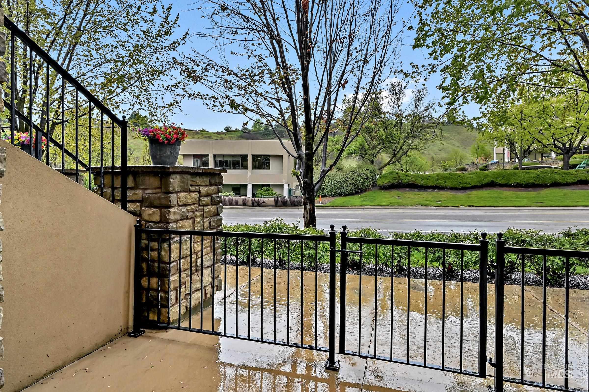 2476 North Bogus Basin Road Boise, ID 83702 - Photo 35 of 48 First-level patio with railing and space for outdoor seating. Great area for relaxing or dining with a view across the street toward foothills trails.