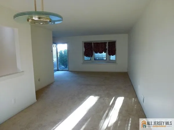 a view of a hallway with a chandelier