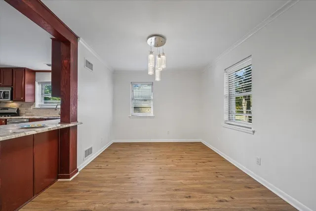 a view of kitchen and kitchen with sink
