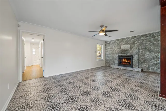 wooden floor in an empty room with a fireplace