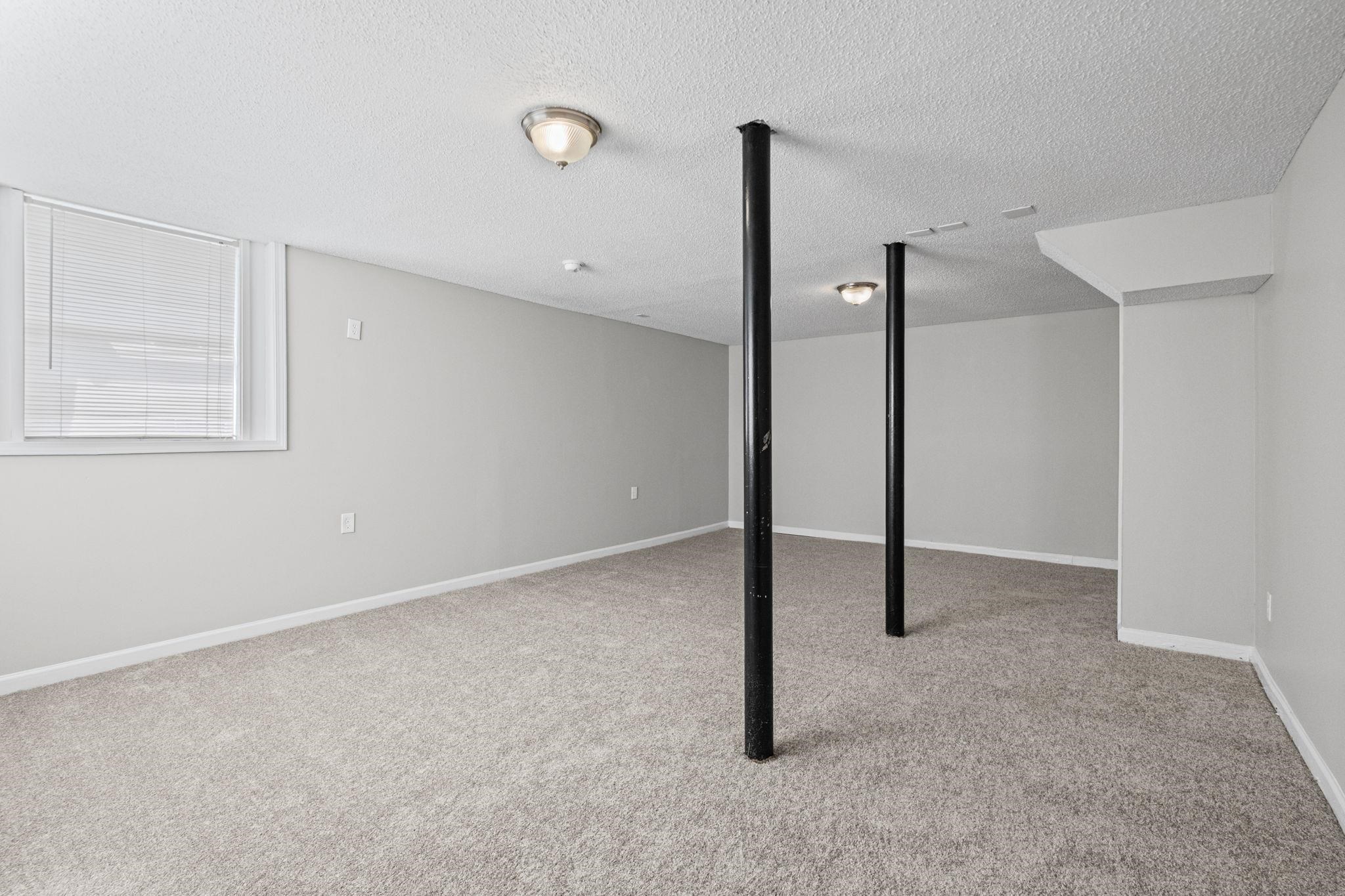 3580 Ramill Road Memphis, TN 38128 - Photo 15 of 24 Finished below grade area with light colored carpet and a textured ceiling