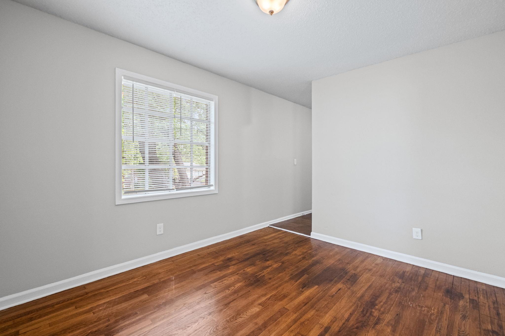 3580 Ramill Road Memphis, TN 38128 - Photo 6 of 24 Unfurnished room with dark wood-style floors