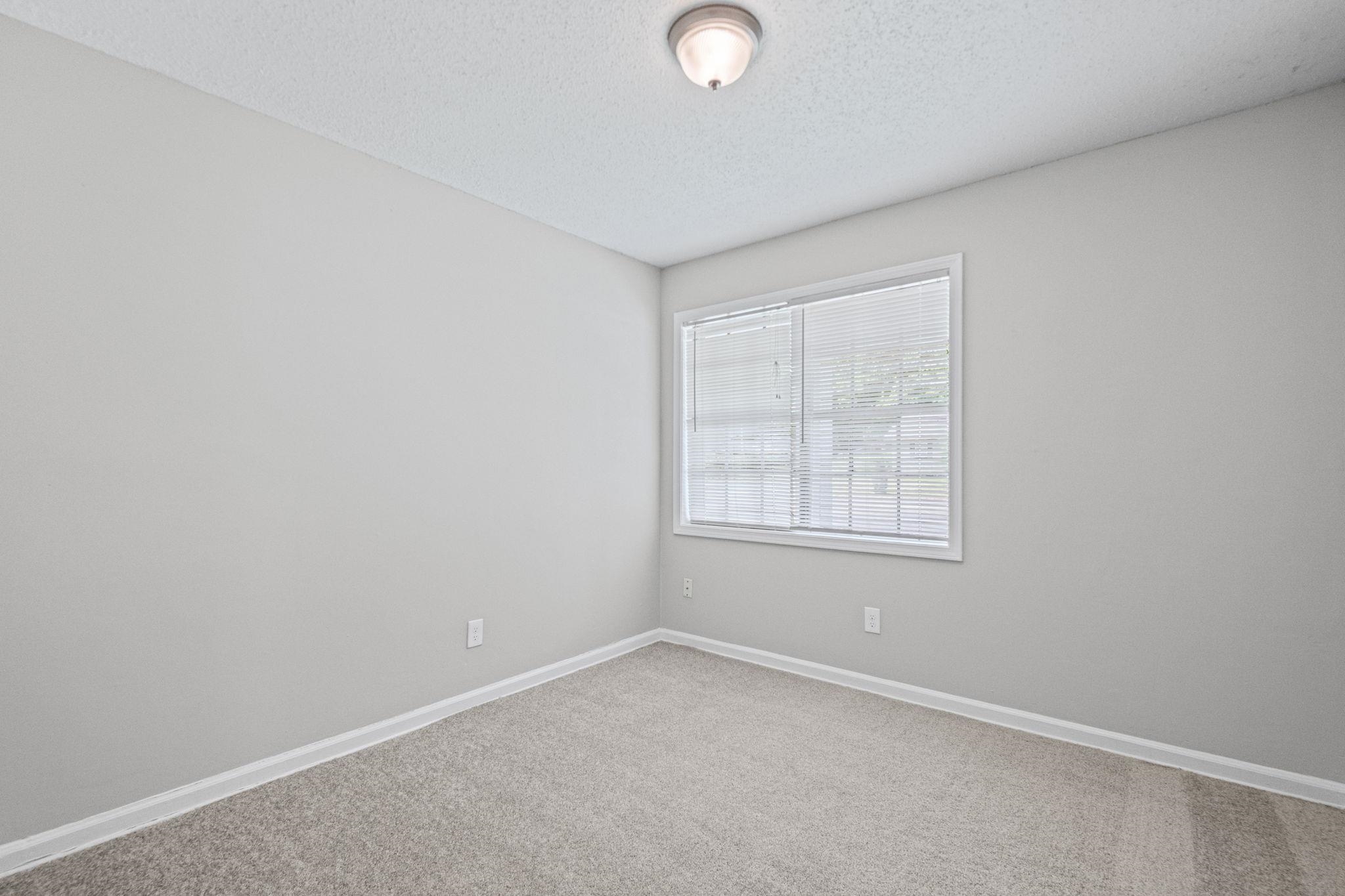 3580 Ramill Road Memphis, TN 38128 - Photo 10 of 24 Carpeted spare room with baseboards and a textured ceiling