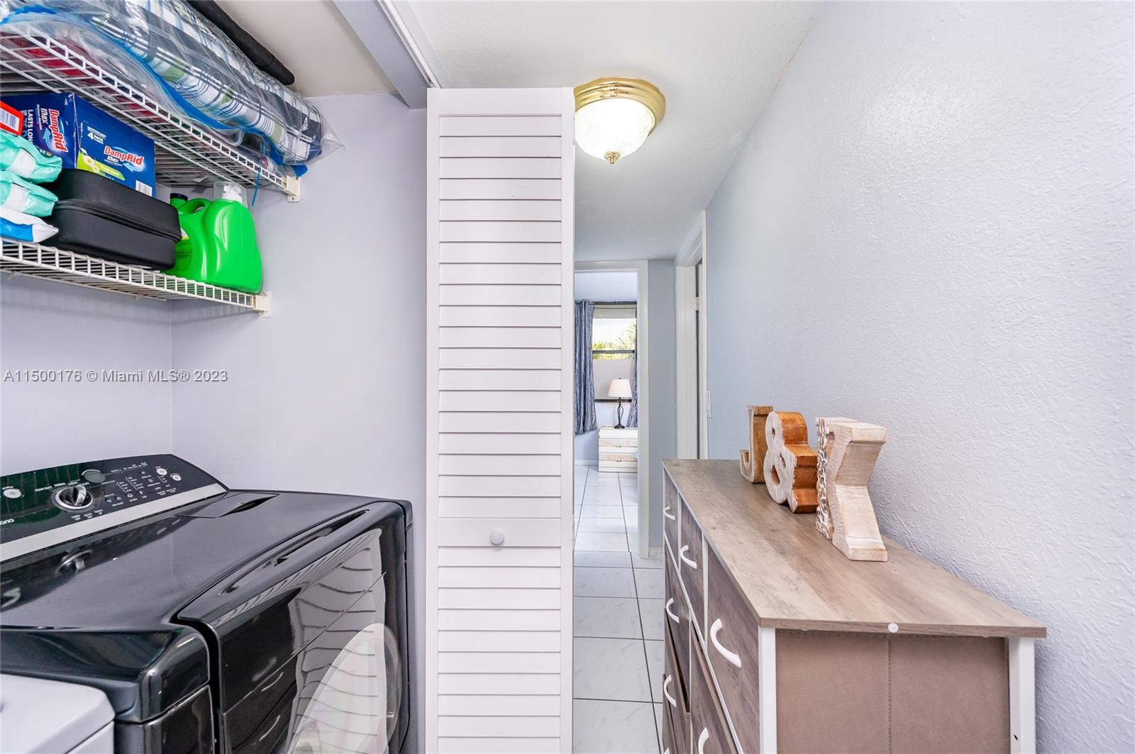 12239 Southwest 14th Lane, Unit 3401 Miami, FL 33184 - Photo 11 of 23 a bathroom with a sink and a mirror