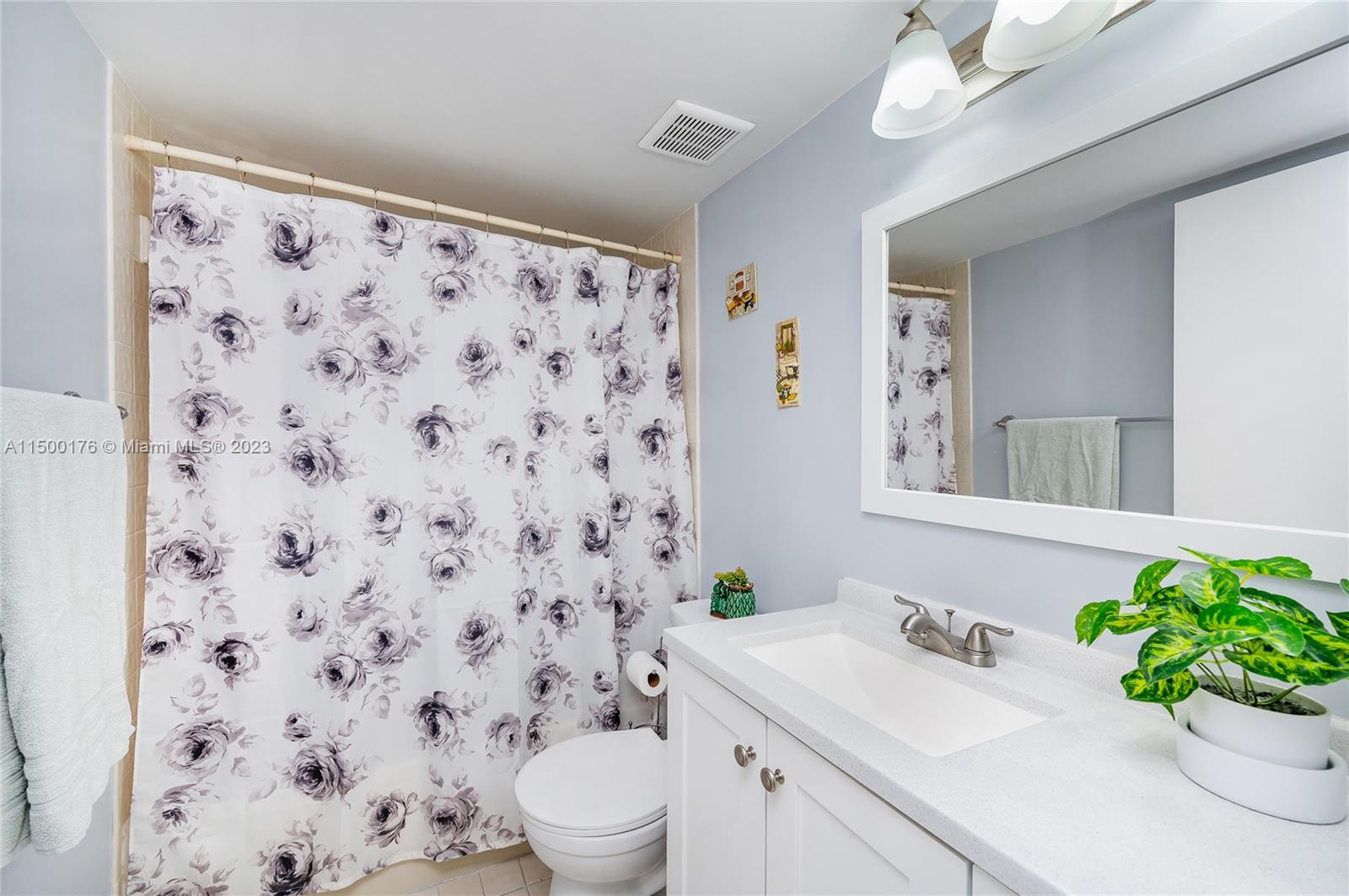12239 Southwest 14th Lane, Unit 3401 Miami, FL 33184 - Photo 17 of 23 a bathroom with a sink toilet and shower
