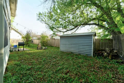 a view of backyard with green space