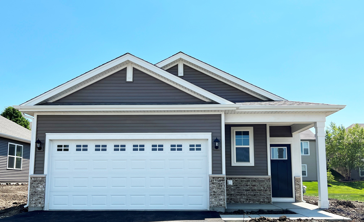a front view of a house with a garage