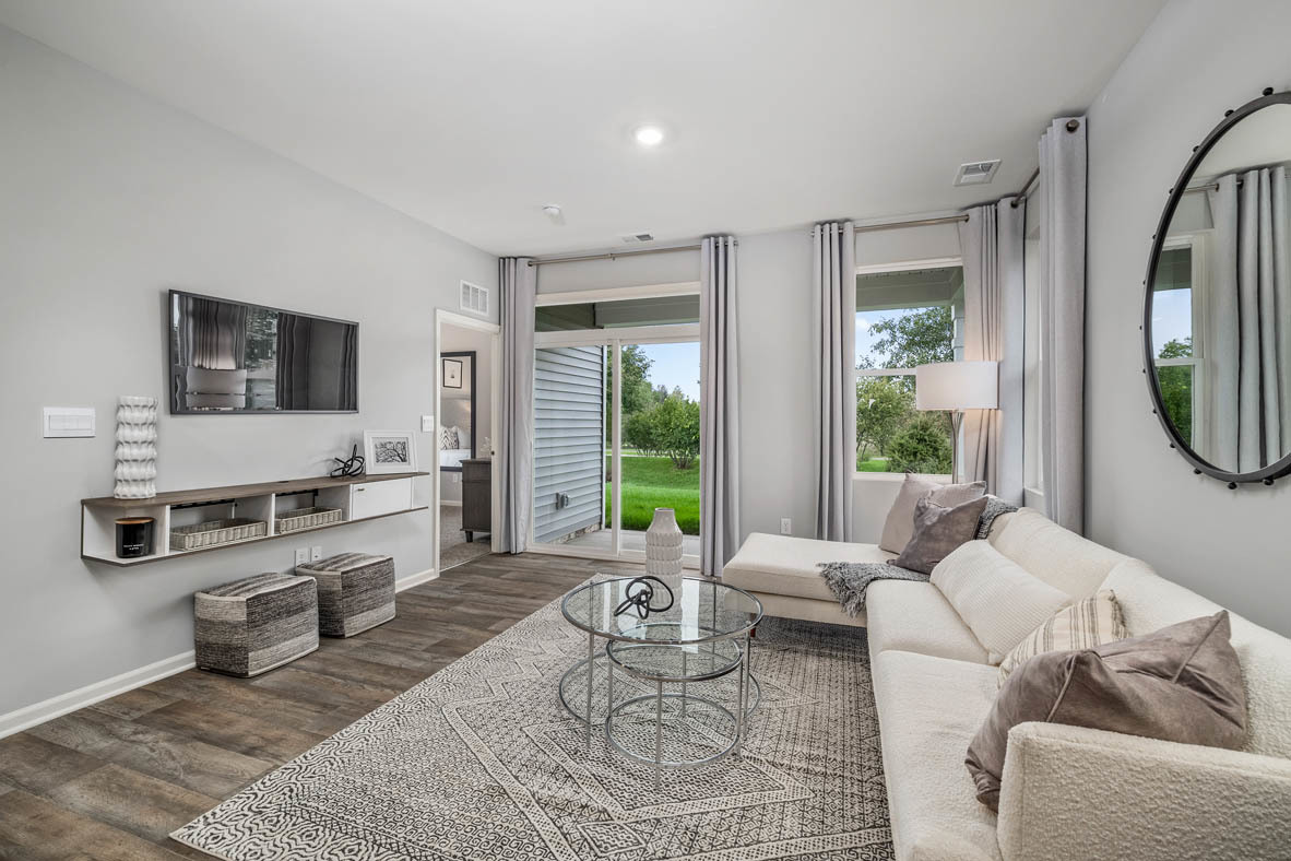 890 Eineke Boulevard Algonquin, IL 60102 - Photo 13 of 27 a living room with furniture a flat screen tv and a large window