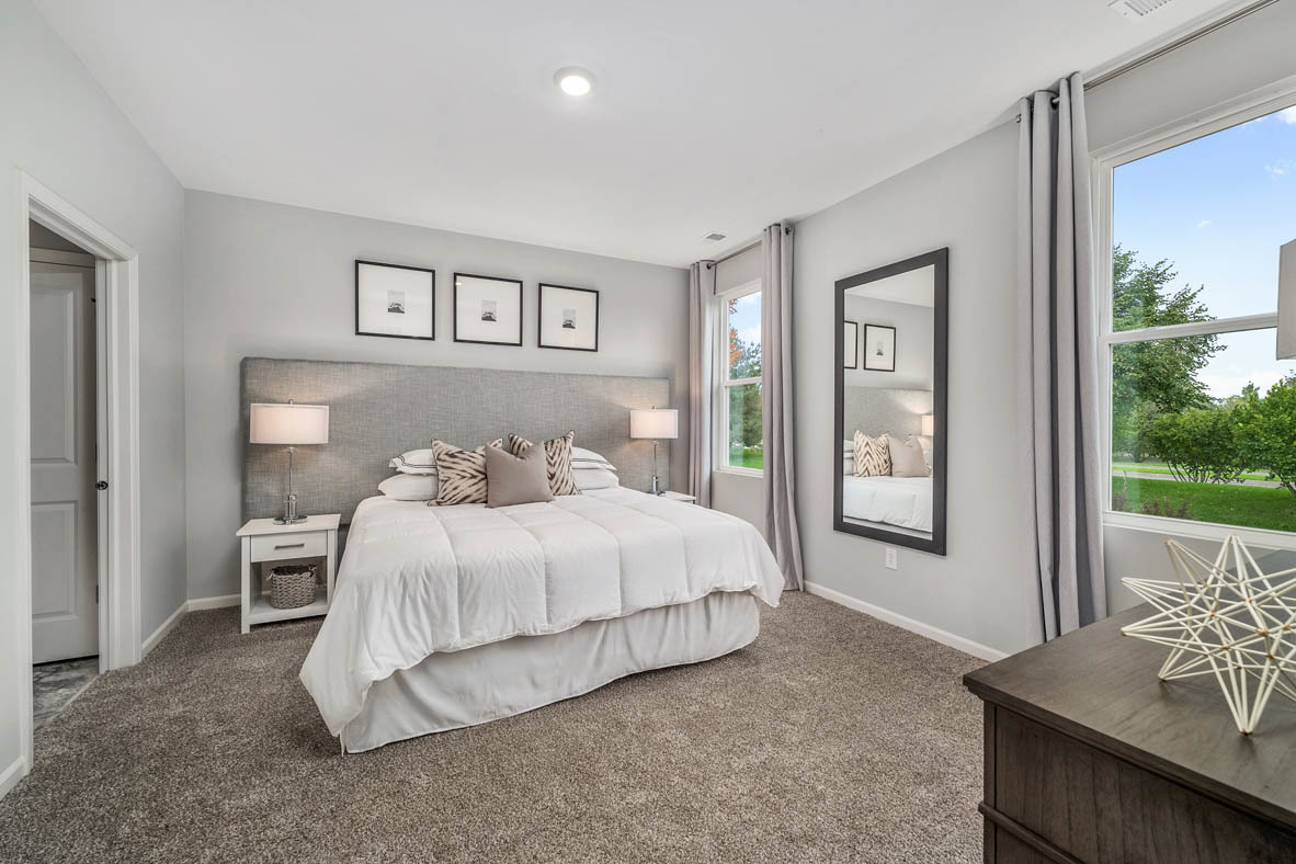 890 Eineke Boulevard Algonquin, IL 60102 - Photo 16 of 27 a bedroom with a bed and a window