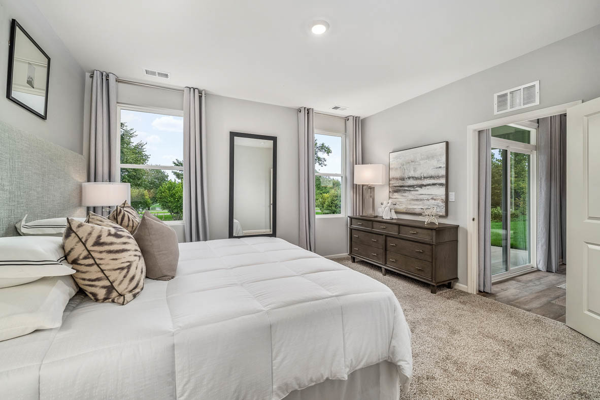 890 Eineke Boulevard Algonquin, IL 60102 - Photo 17 of 27 a bedroom with a bed and a large window