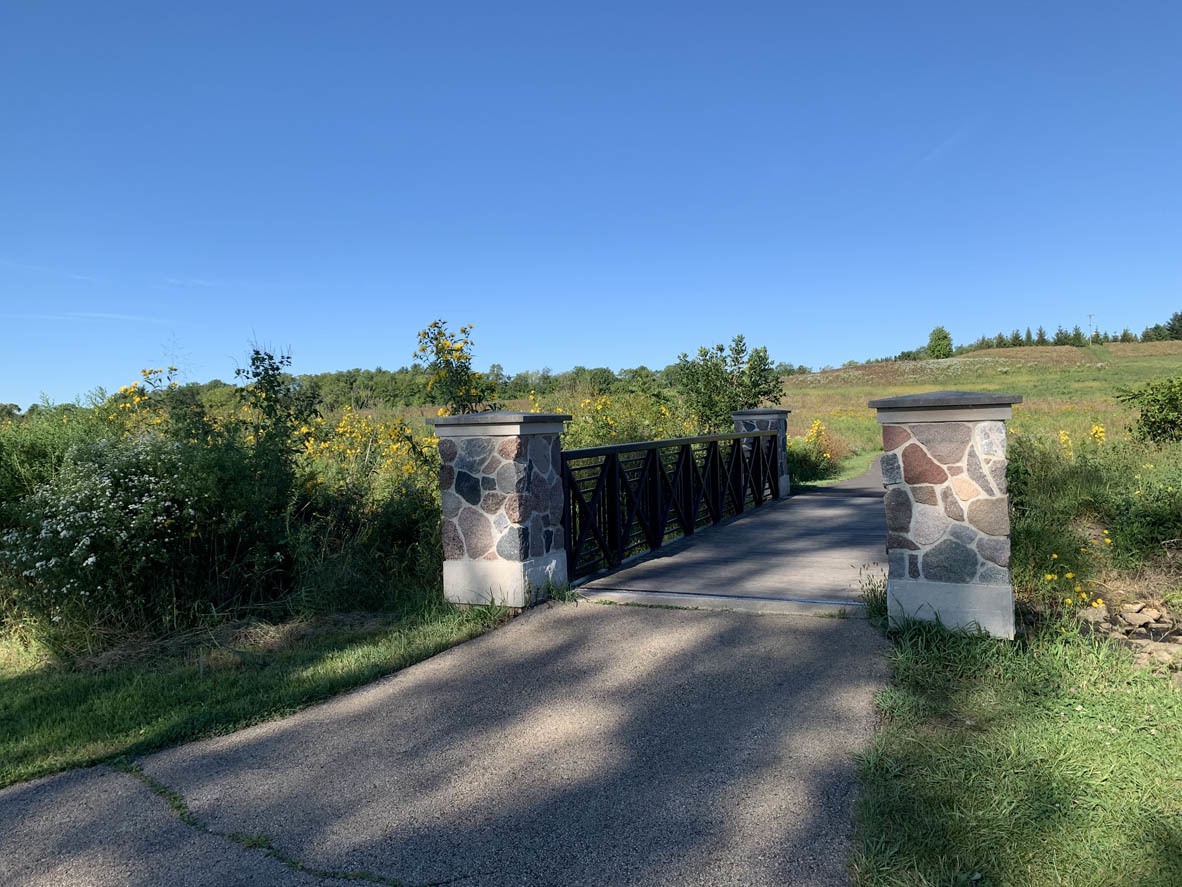 890 Eineke Boulevard Algonquin, IL 60102 - Photo 22 of 27 a view of a pathway with a wrought fence