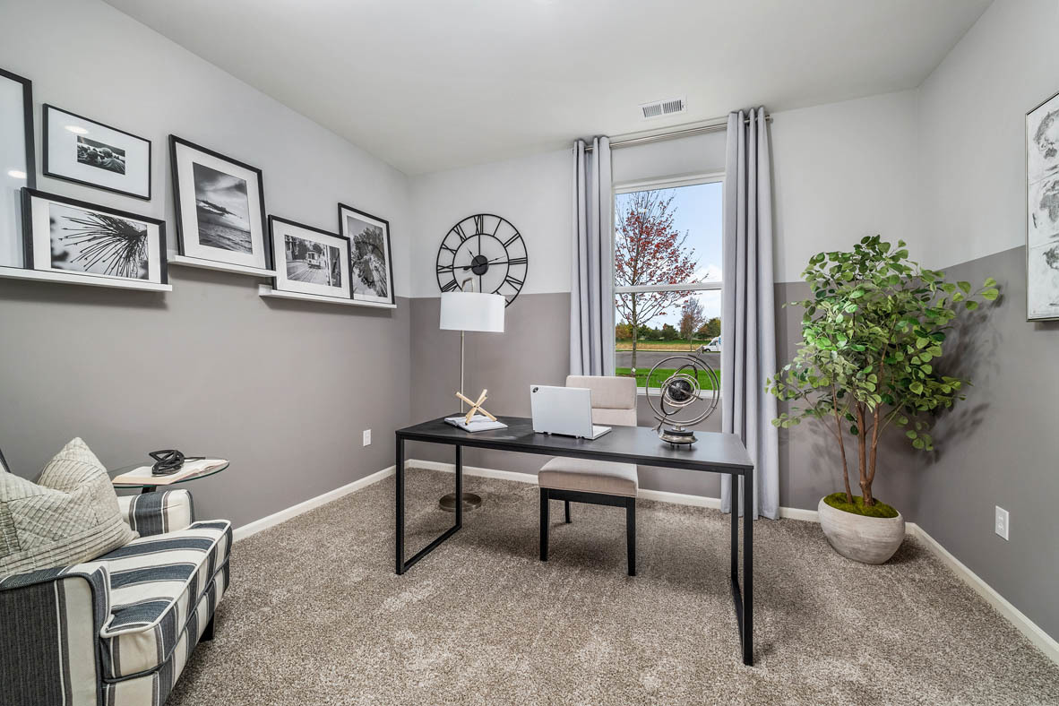 890 Eineke Boulevard Algonquin, IL 60102 - Photo 3 of 27 a view of a workspace with furniture and a potted plant