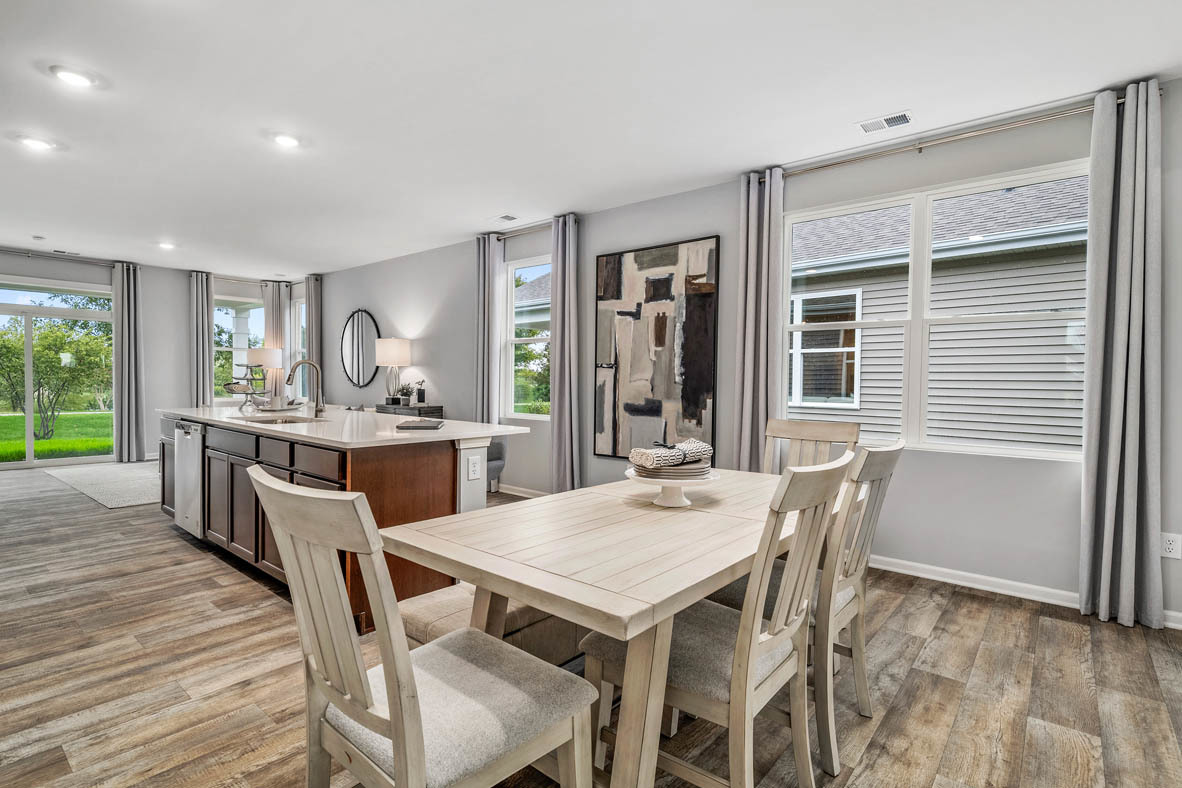 890 Eineke Boulevard Algonquin, IL 60102 - Photo 6 of 27 a view of a dining room with furniture and wooden floor