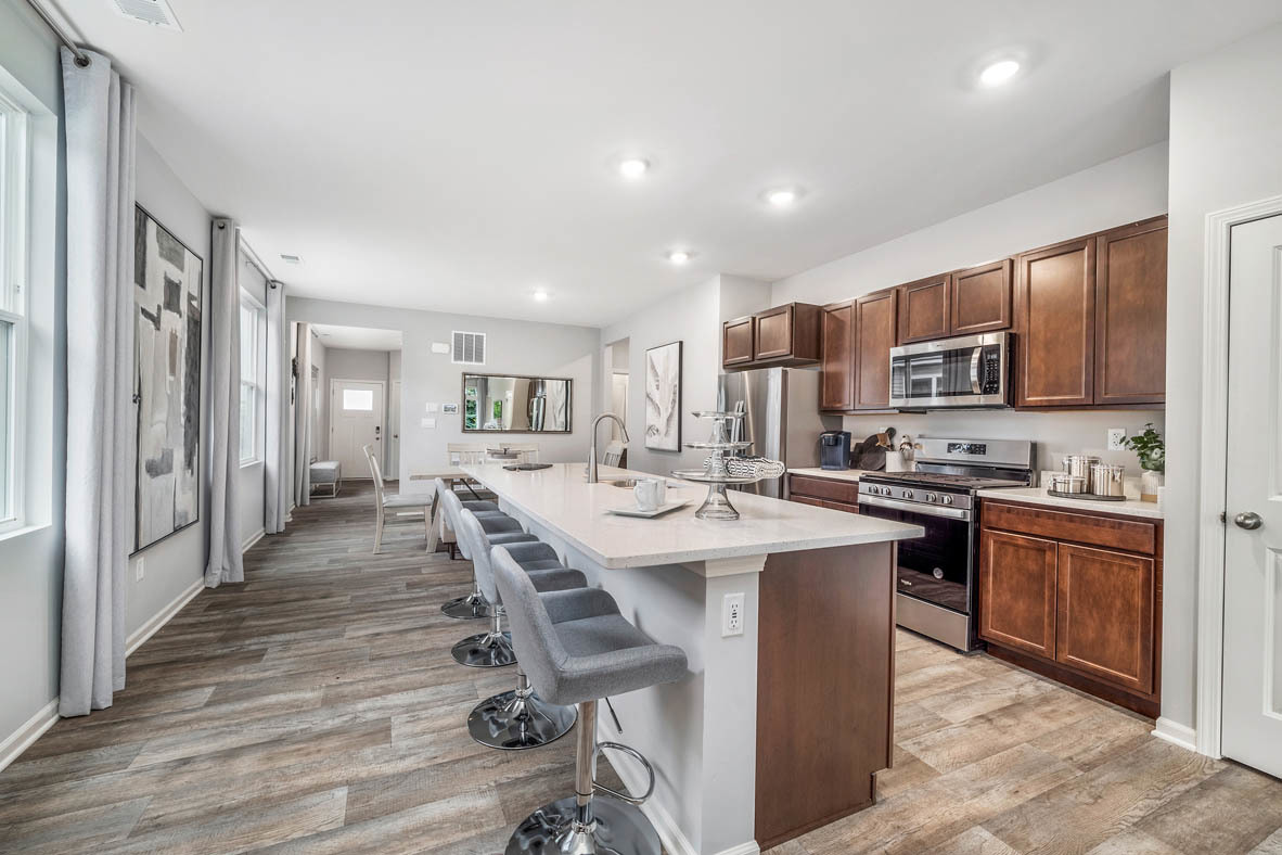 890 Eineke Boulevard Algonquin, IL 60102 - Photo 8 of 27 a large kitchen with kitchen island granite countertop lots of wooden cabinets a sink and stainless steel appliances