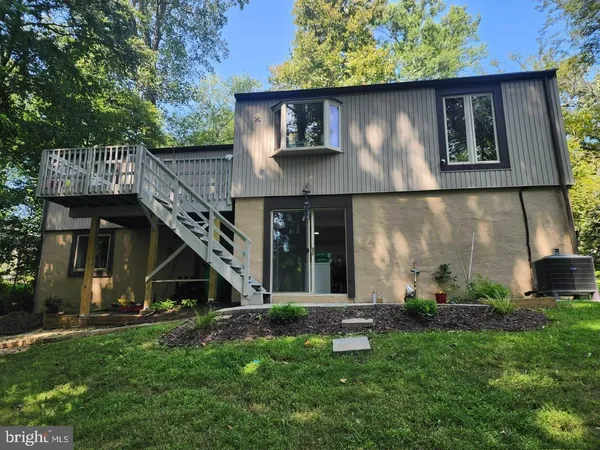 a front view of house with green space