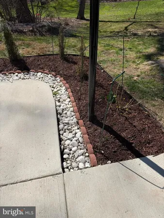 a view of a backyard with wooden fence