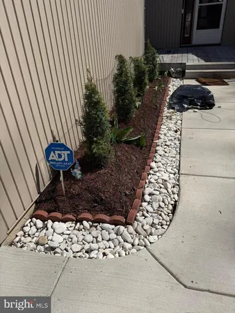 a view of a backyard with sitting area