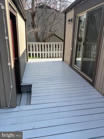 a view of balcony with wooden floor