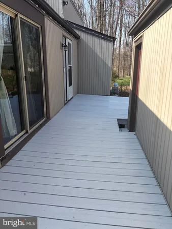 a balcony view with a wooden floor