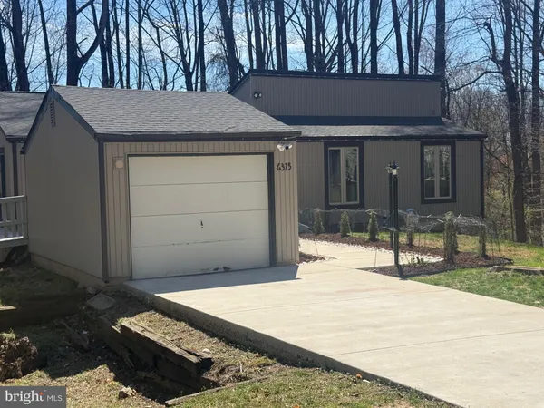 a house view with a outdoor space