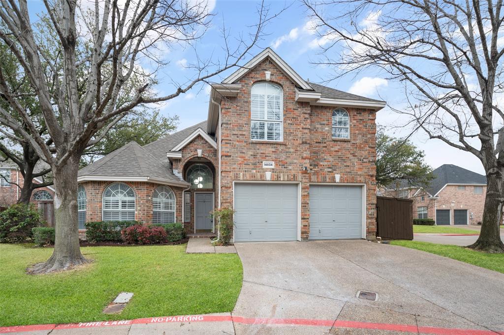 14604 Hemingway Court Addison, TX 75001 - Photo 24 of 27 a front view of a house with a yard and garage