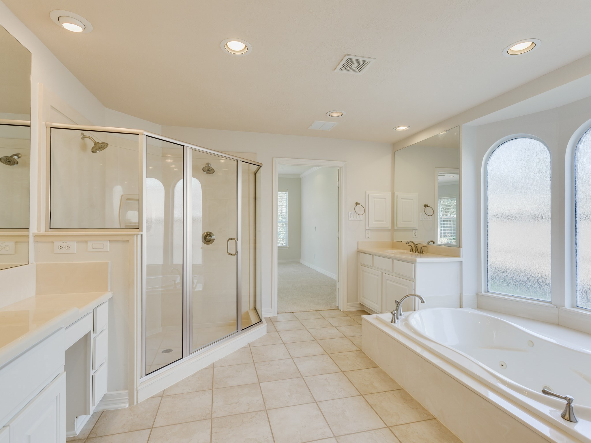 6327 Collina Springs Court Houston, TX 77041 - Photo 16 of 35 a spacious bathroom with a tub shower and sink
