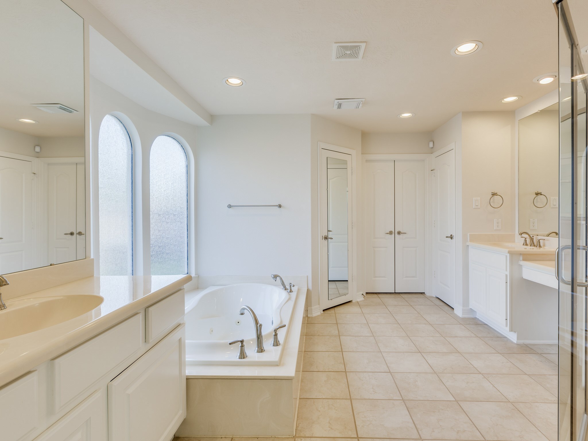 6327 Collina Springs Court Houston, TX 77041 - Photo 17 of 35 a spacious bathroom with a tub shower and sink