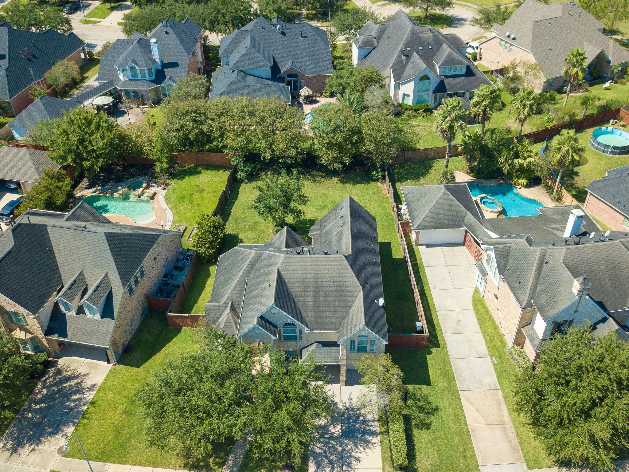 6327 Collina Springs Court Houston, TX 77041 - Photo 28 of 35 an aerial view of a house with swimming pool and outdoor seating
