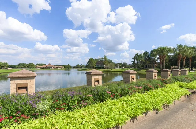 a view of a lake with a house in the background