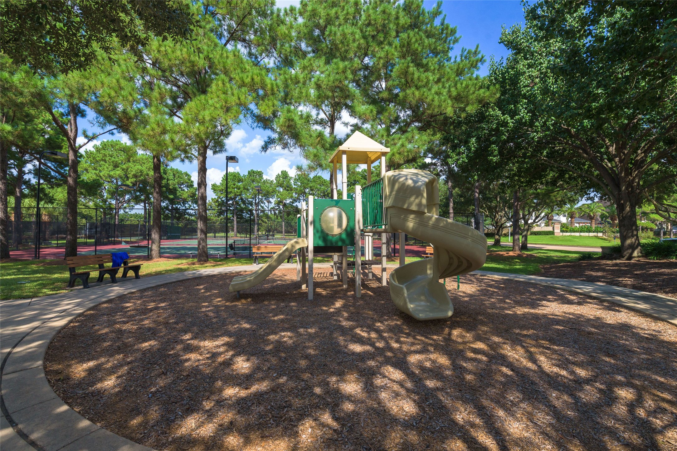 6327 Collina Springs Court Houston, TX 77041 - Photo 33 of 35 a view of a park with swings and slides