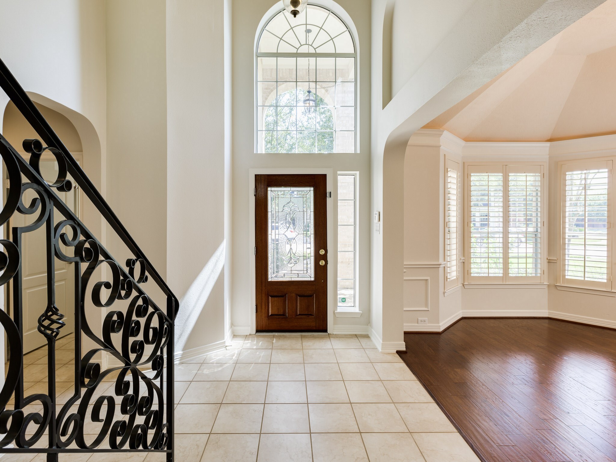 6327 Collina Springs Court Houston, TX 77041 - Photo 4 of 35 wooden floor with an entryway in a hall with a window