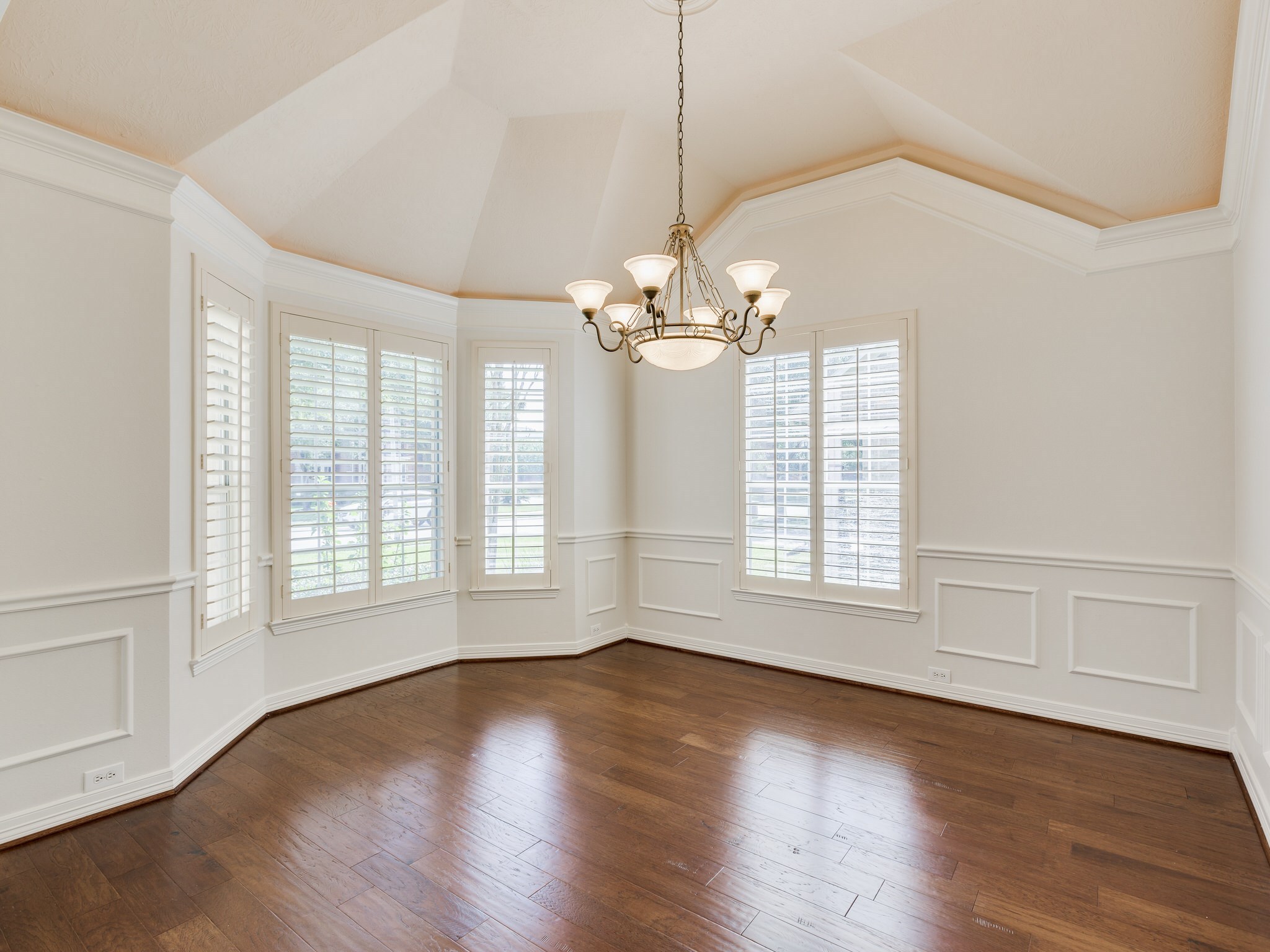6327 Collina Springs Court Houston, TX 77041 - Photo 5 of 35 a view of an empty room with wooden floor and a window