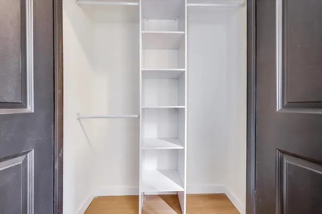 a view of an empty walk in closet