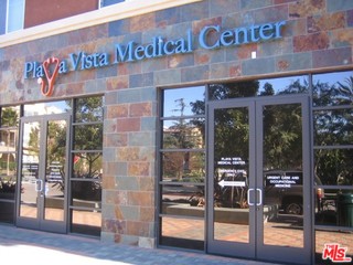 12963 West Runway Road, Unit 221 Playa Vista, CA 90094 - Photo 18 of 20 a front view of a building with glass door and glass door